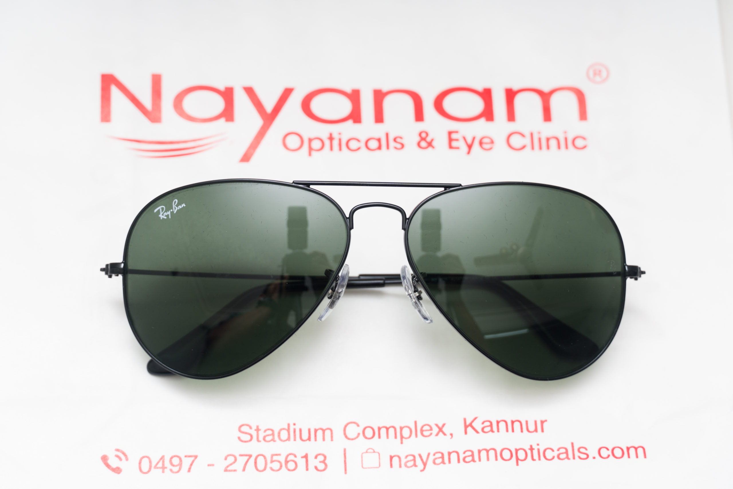 Nayanam Optical Centre Payyanur, Optical Centre in Payyanur, Opticals in Payyannur, Ray-Ban dealers in payyanur, Opticians in Payyanur, Optical shops in Kerala, Opticians in Kerala, Buy spectacles online from kerala, online opticians from kerala, leading opticians from kerala, eye hospitals in kerala, eye specialists in kerala, spectacle frames kerala, branded spectacle frames kerala, contact lenses kerala, ophthalmic lenses kerala, Ejones opticals, optical lenses kerala, progressive lenses, bi focal lenses kerala, high index lenses kerala, compressed lenses kerala, varifocal lenses kerala, multifocal lenses kerala, crizal lenses kerala, crizal a2 lenses kerala, shamir lenses kerala, airwear lenses kerala, antireflective lenses kerala, antiglare lenses kerala, day and night lenses kerala, photochromatic lenses kerala, polarised lenses kerala, polycarbonate lenses kerala, mr8 lenses kerala, scratch resistant lenses kerala, light weight lenses kerala, transition lenses kerala, varilux lenses kerala, vision correction kerala, vision problems kerala, free eye testing kerala, rayban kerala, cataract lenses kerala, cataract surgery kerala, presbiopic lenses kerala, vogue frames and sunglasses kerala, oakley frames and sunglasses kerala, adidas frames and sunglasses kerala, safilo frames kerala, carrera frames and sunglasses kerala, prada kerala, versace frames and sunglasses kerala, montblanc frames kerala, police frames and sunglasses kerala, puma frames and sunglasses kerala, emporio armani kerala, silhouette kerala, optimed kerala, hoya lenses kerala, zeiss lenses kerala, asahi lenses kerala, AO lenses kerala, essilor lenses kerala, Bausch and lomb contact lenses kerala, Johnson and Johnson contact lenses kerala, acuvue contact lenses kerala, nikkon lenses kerala, kodak lenses kerala, fast track sunglasses, power glass kerala, powered sunglasses kerala, lens cart kerala, lens and frames kerala, prescription sunglasses kerala, contact lens solution kerala, Looking to buy best online opticians or glasses? nayanamopticals.com is the first and longest serving successful online optical store in India.